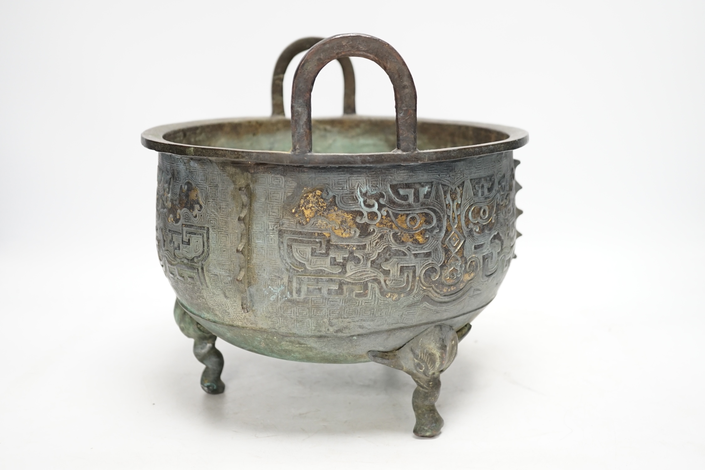 A large Chinese parcel gilt bronze tripod censer, 24.5cm high, 25cm diameter. Condition - fair